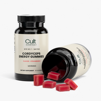 Two bottles of Cult Everyday Cordyceps Energy Gummies with strawberry gummies spilled out